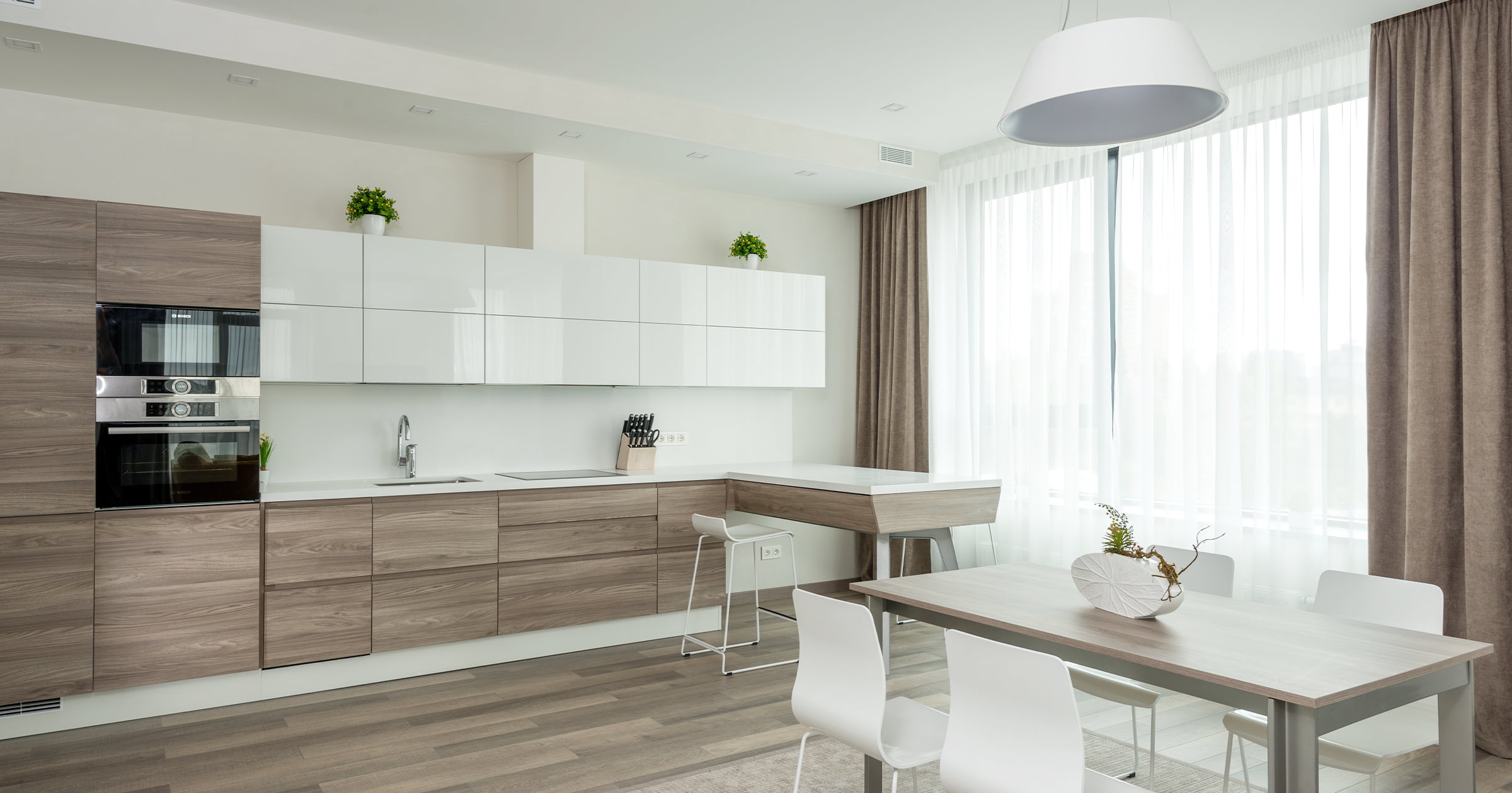 modern kitchen with natural wood cabinets