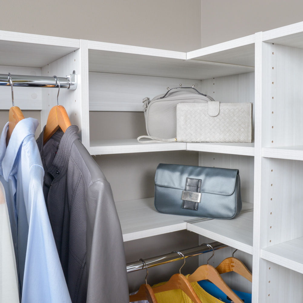 white shelving with multiple purses and wallets