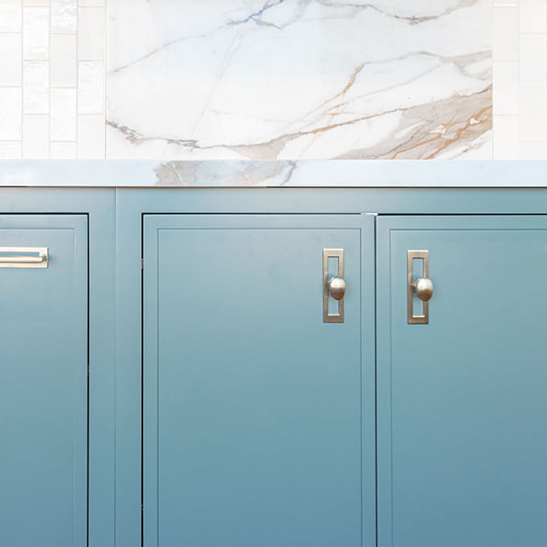 green lower cabinet with gold handles