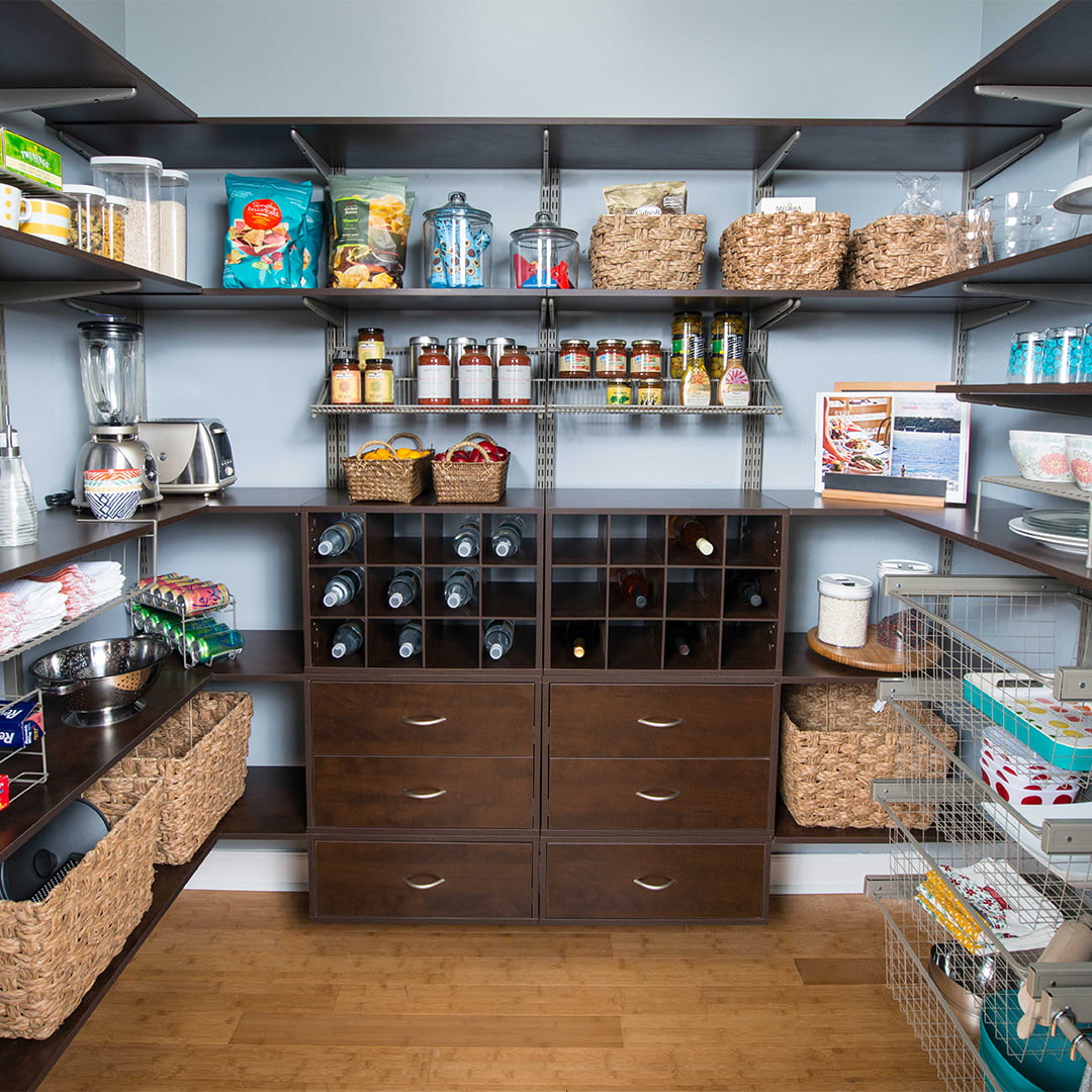 large walk-in pantry with drawers, shelving and baskets