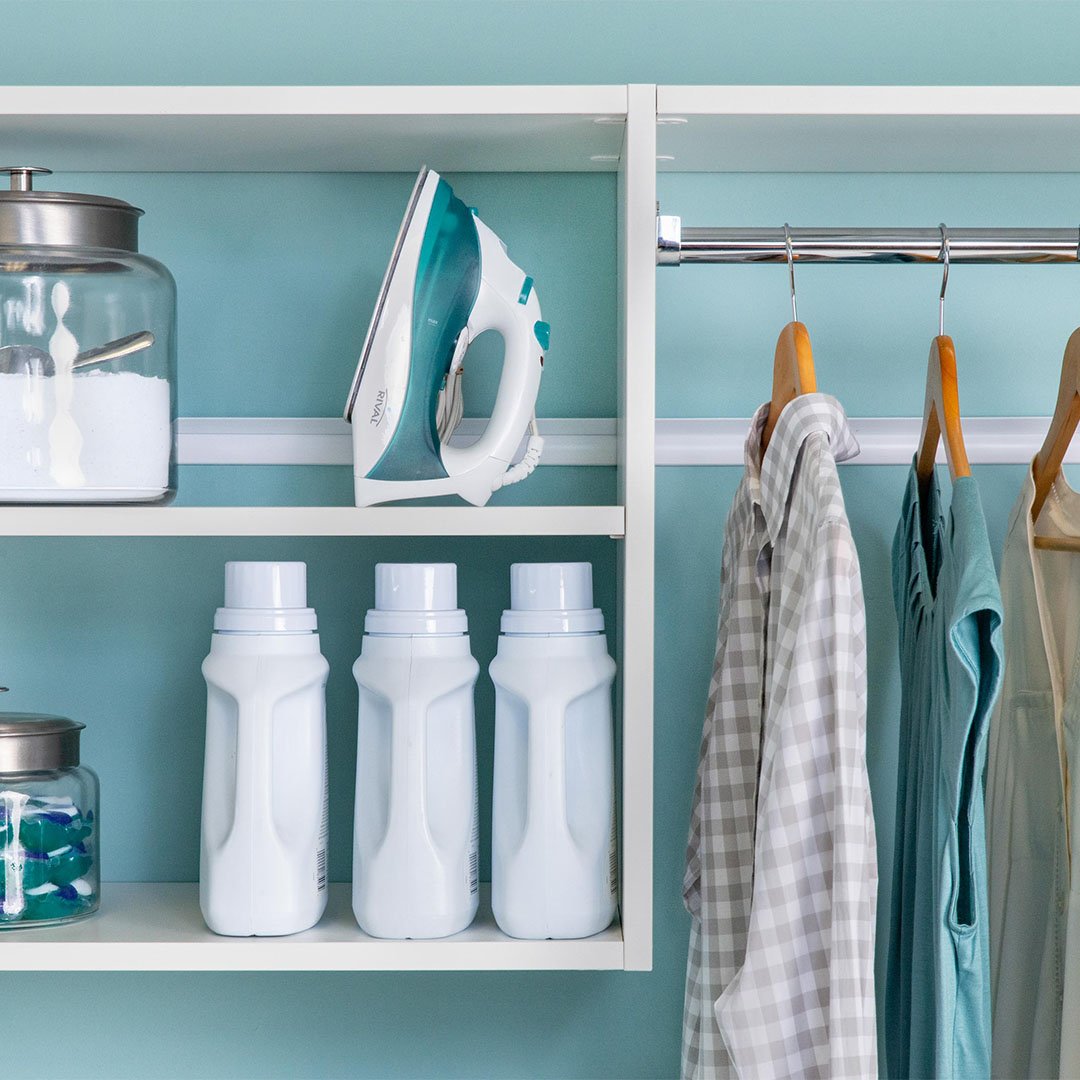 clothes hanging rack on built-in storage system