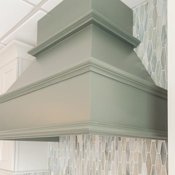 soft green vent hood for residential kitchen