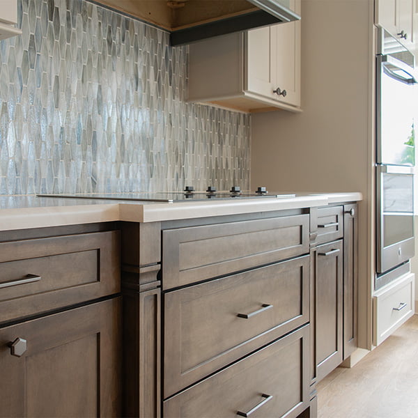 kitchenette with walnut stained cabinets