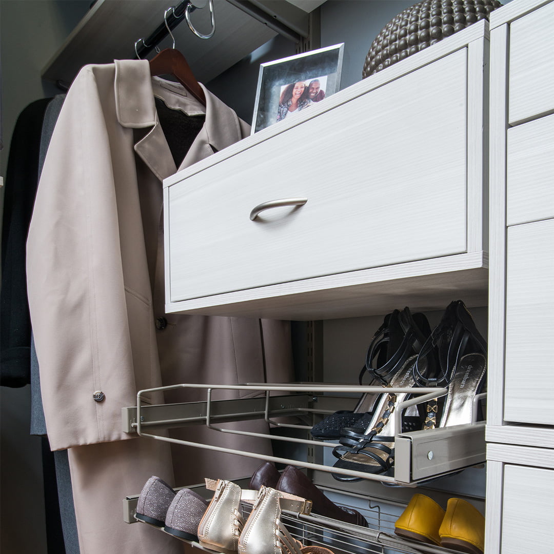 white adjustable storage system in bedroom closet