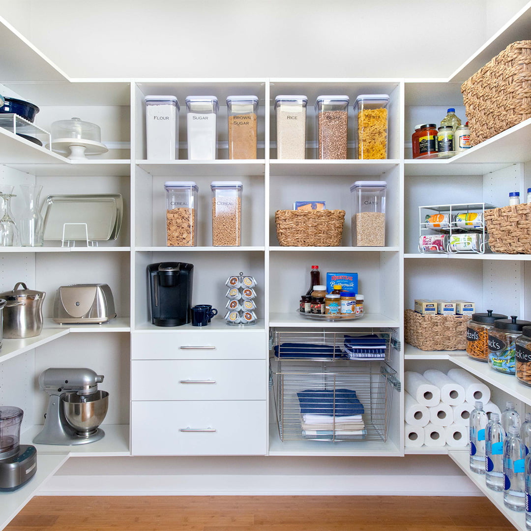 white built-in storage system in kitchen pantry