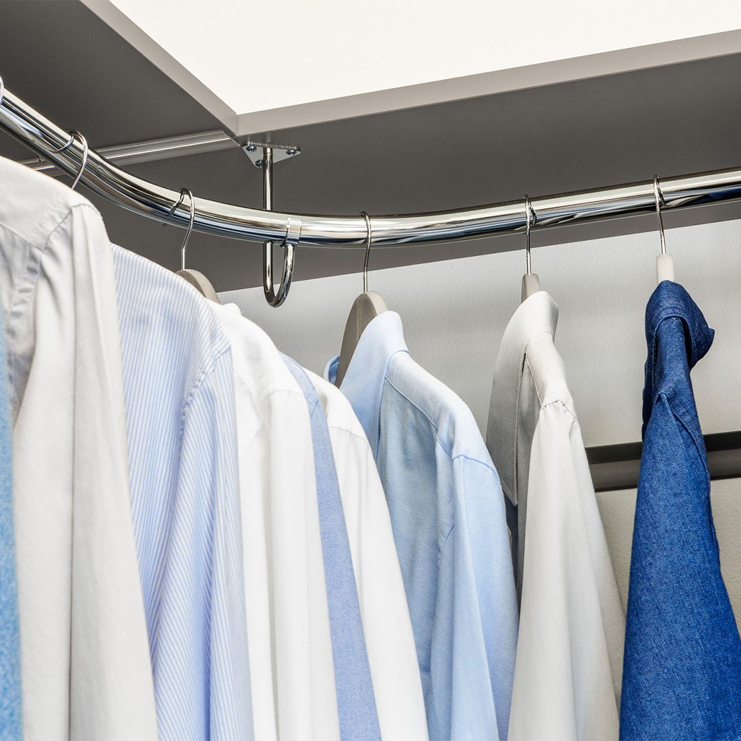 rounded corner clothing rack in closet