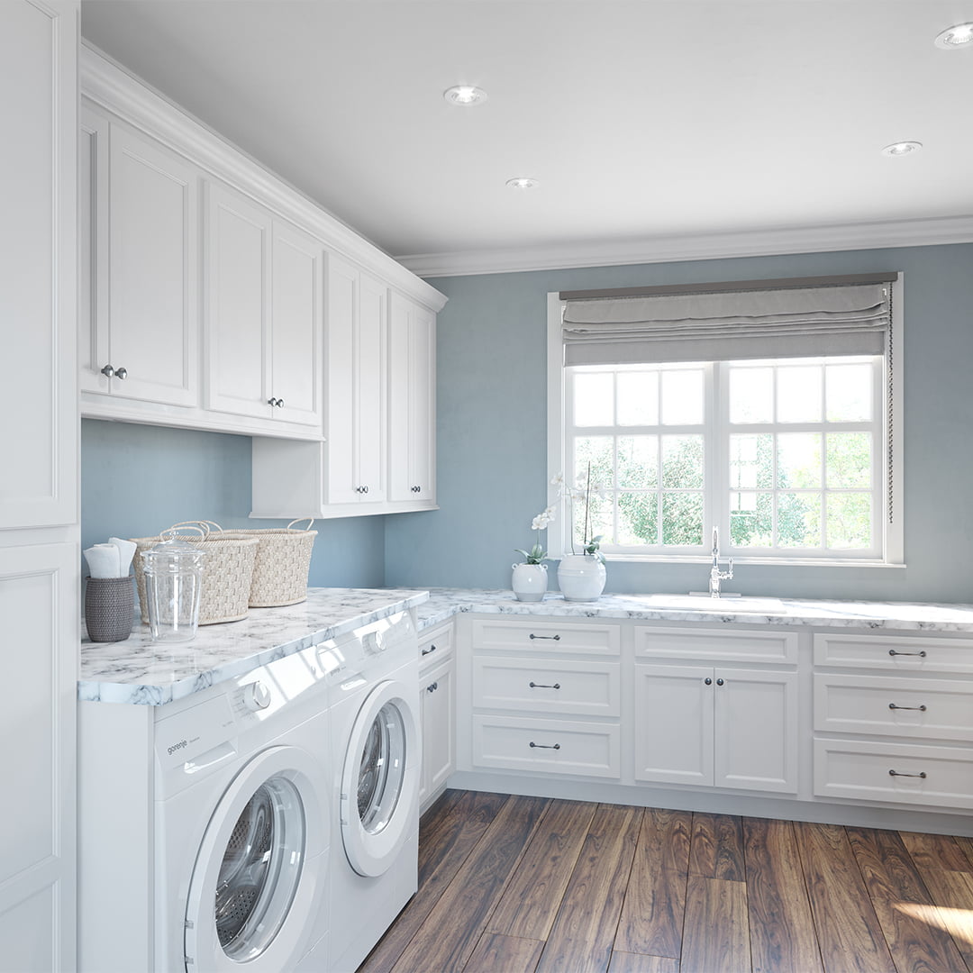 white cabinets in spacious laundry room