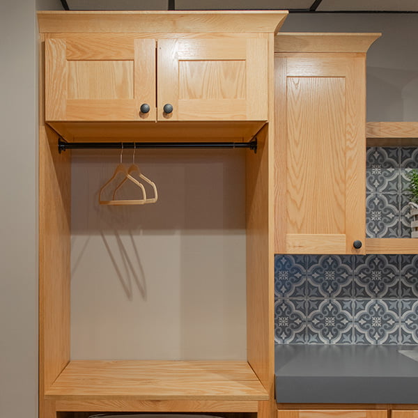 clothes hanging rack in utility cabinet