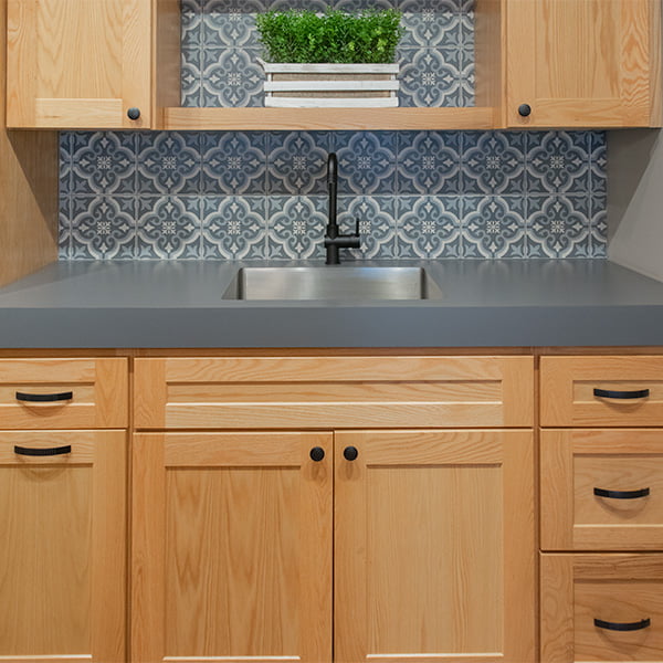 matte black faucet and sink in laundry room