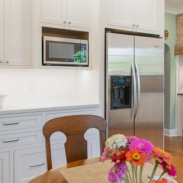 upper cabinets and steel appliances