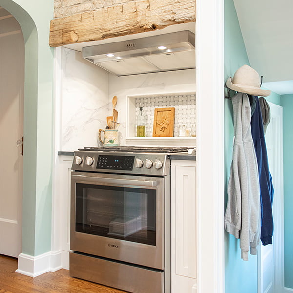 white tray base cabinet next to oven