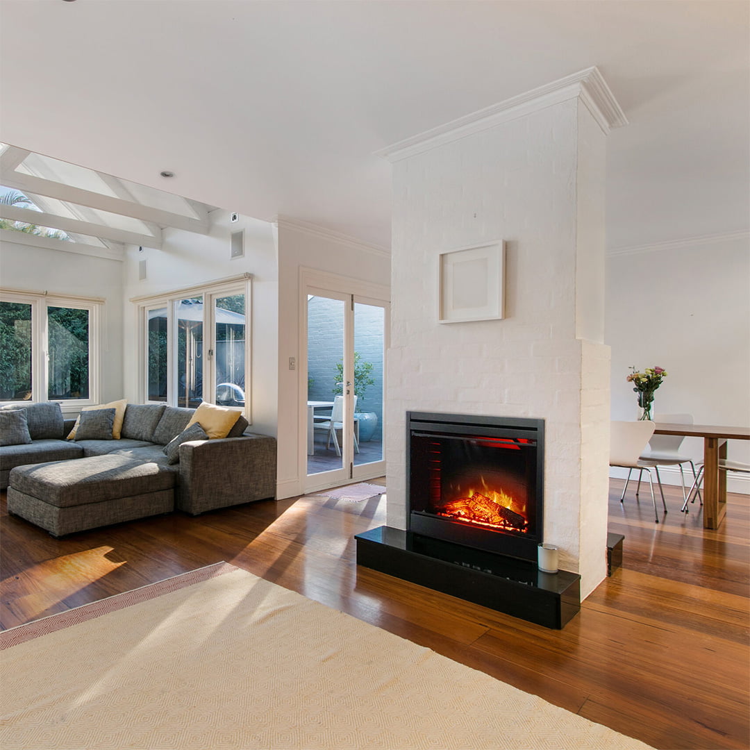 gas fireplace insert in white bricked chimney