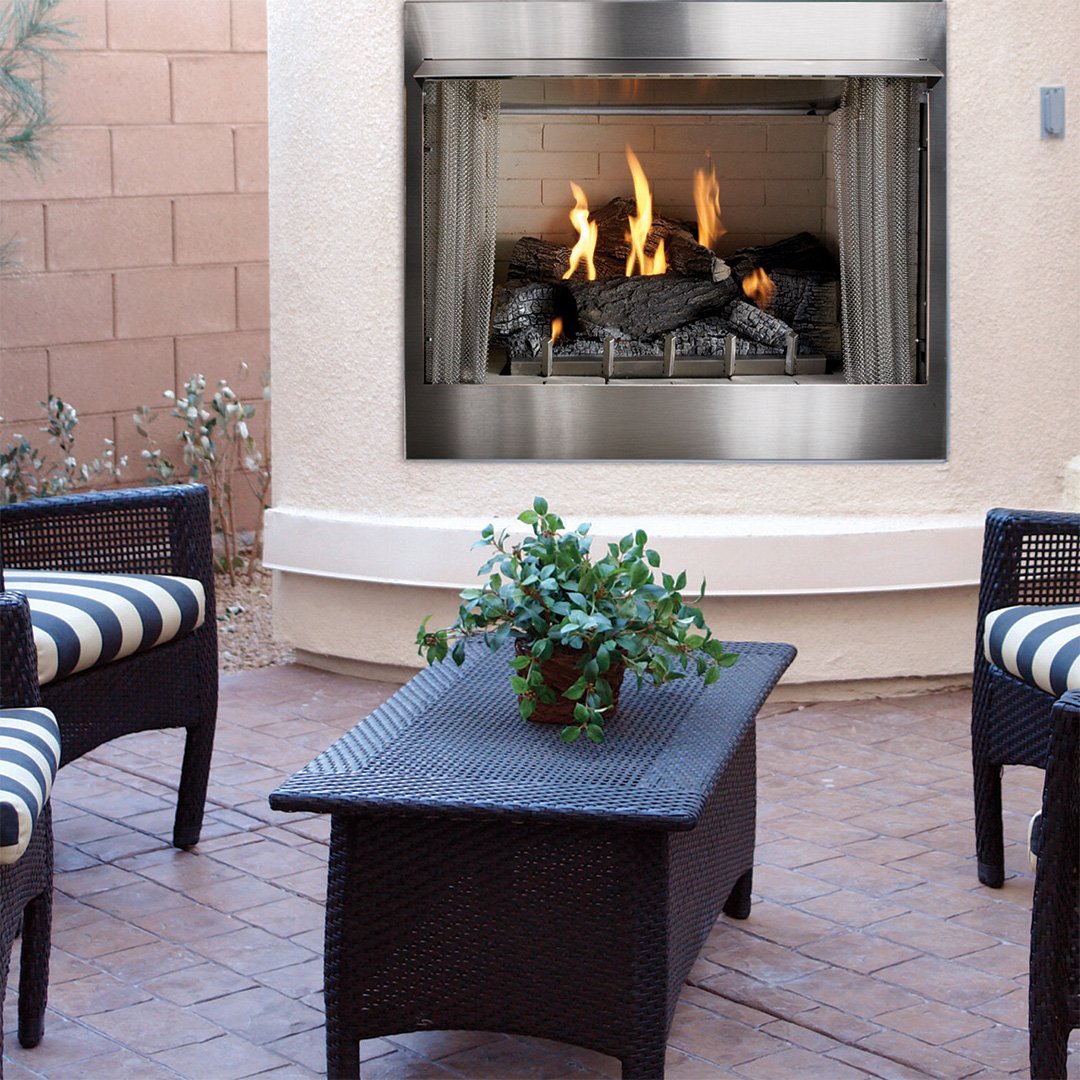 metal fireplace in exterior wall on backyard patio