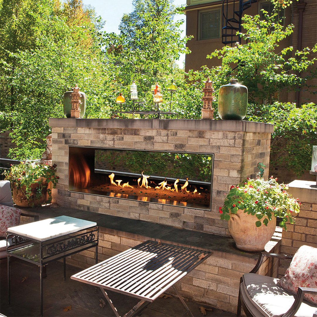 linear gas fireplace on outdoor backyard patio