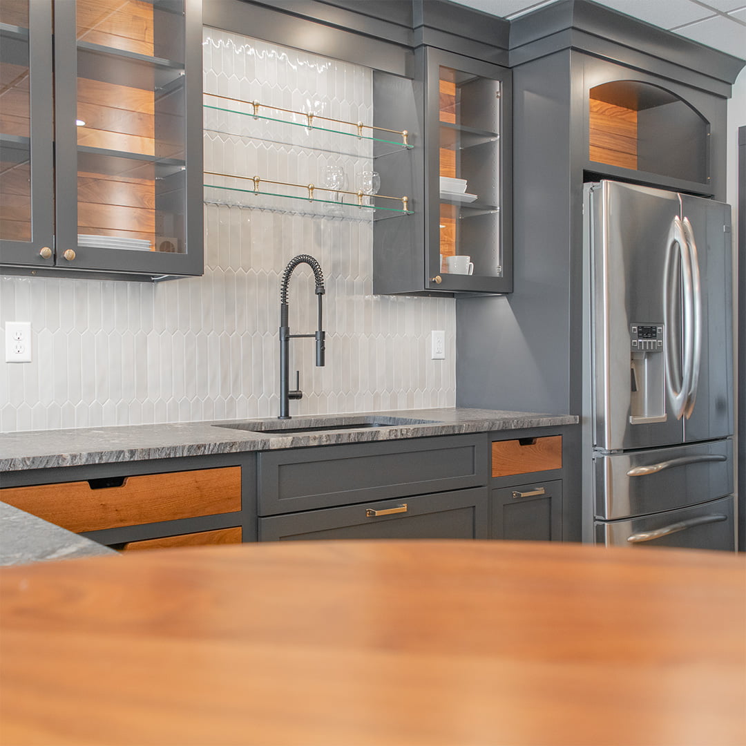 dark kitchen cabinets with matte black sink and faucet