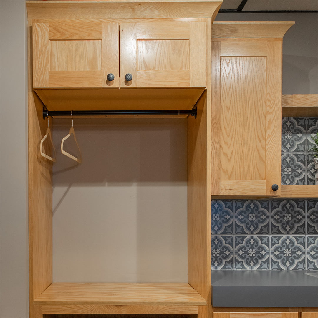 upper cabinets above wooden storage cubby