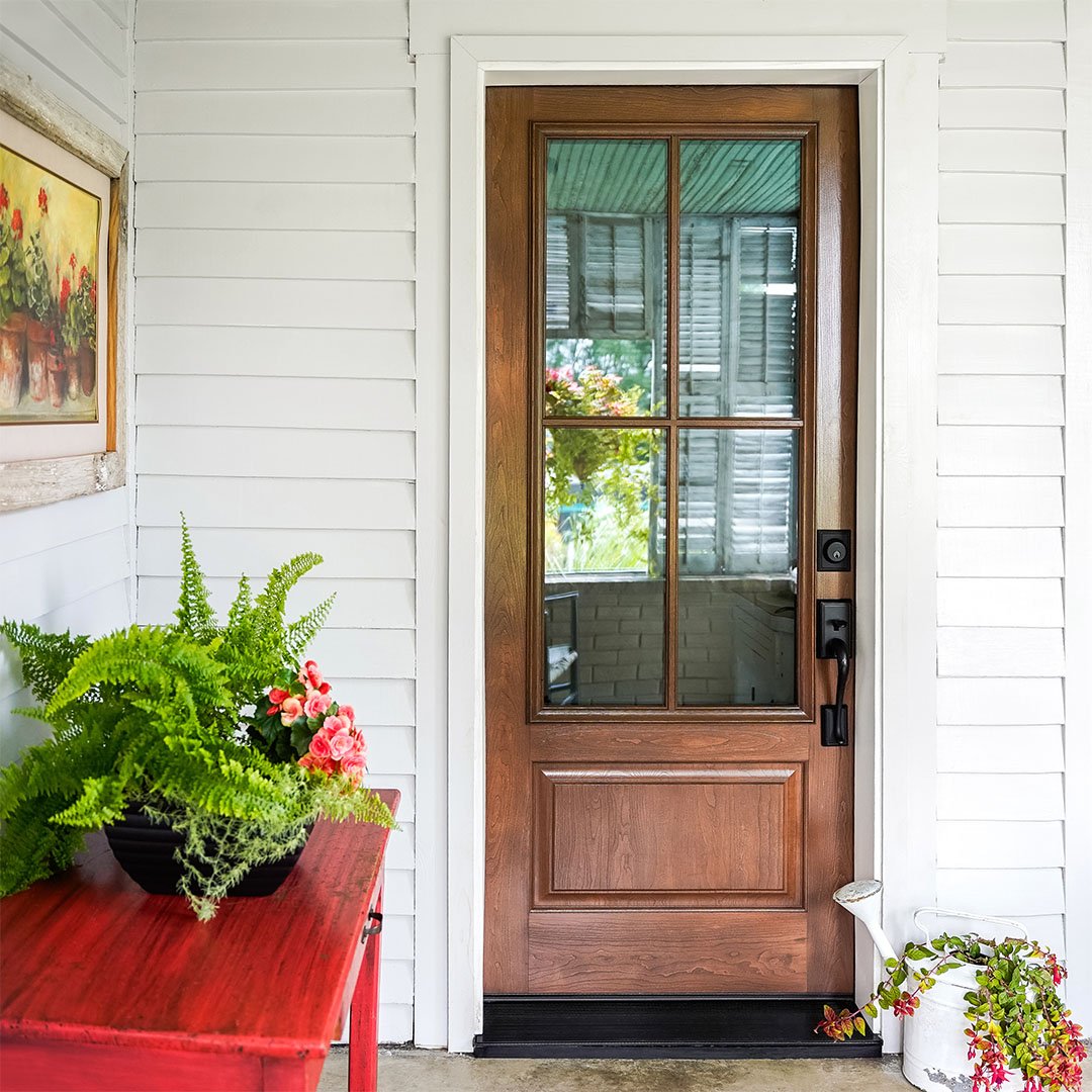 cherry stained entry door with large clear glass pane window