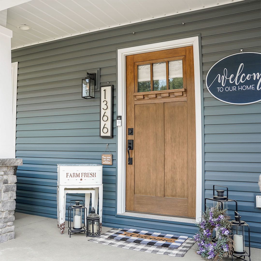 fir grain fiberglass entry door on farmhouse