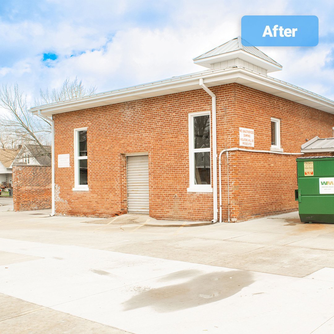 historic brick building with new white vinyl wndows