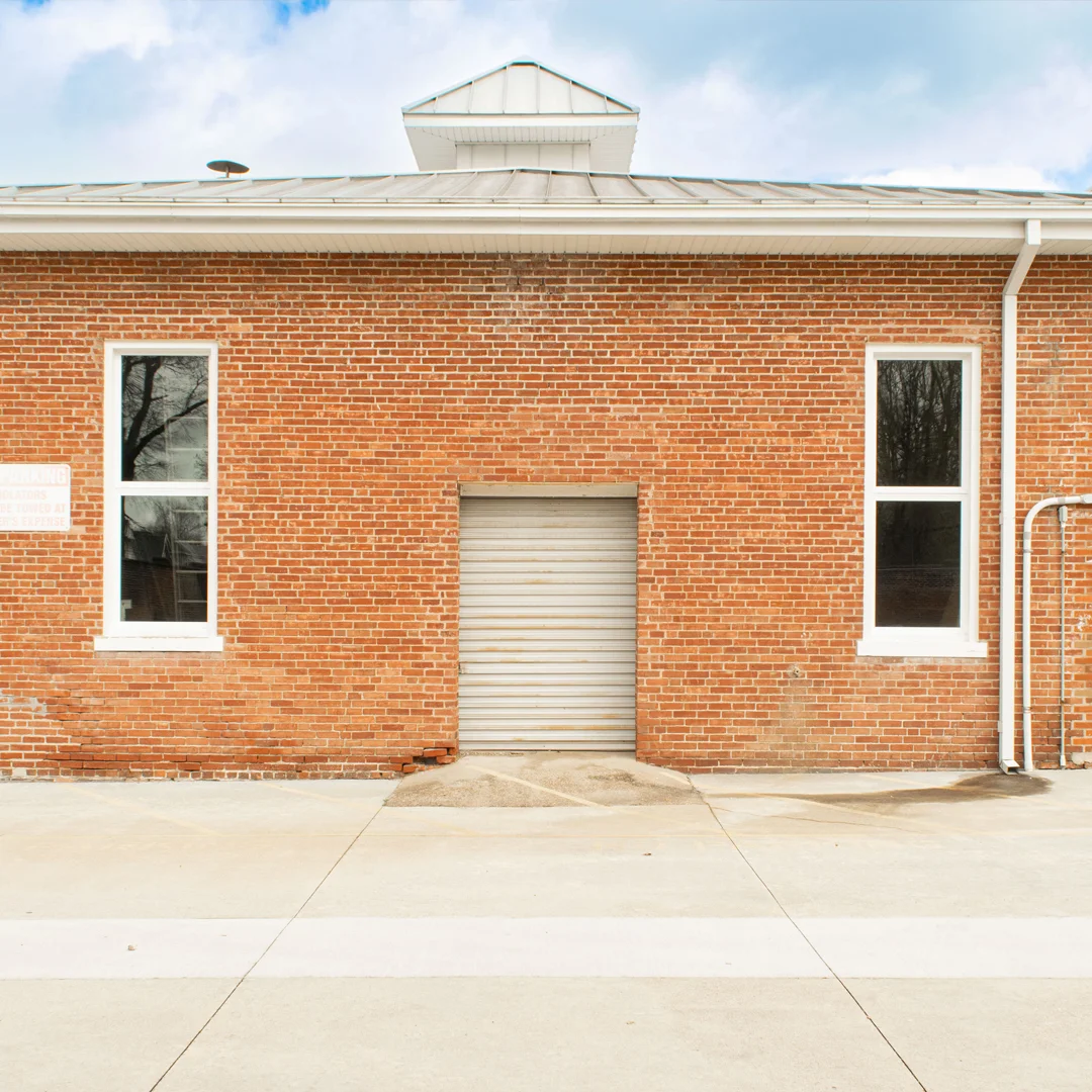 white vinyl windows on brick building