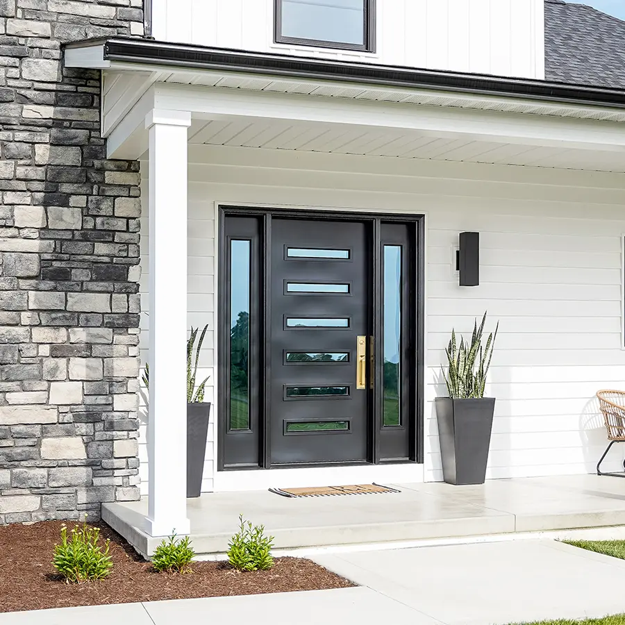 black steel front door on home with white siding