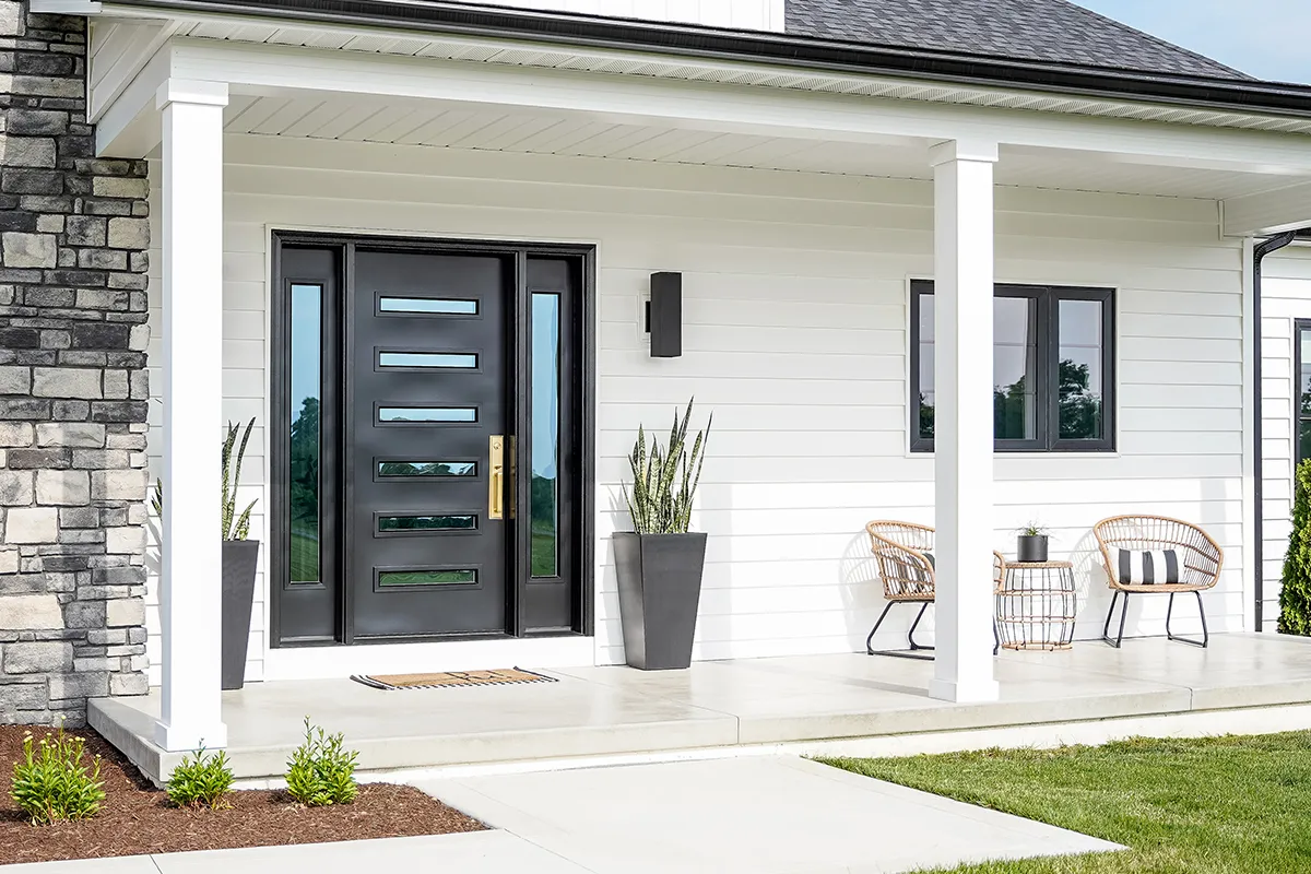 black steel replacement front door with modern glass design on white home