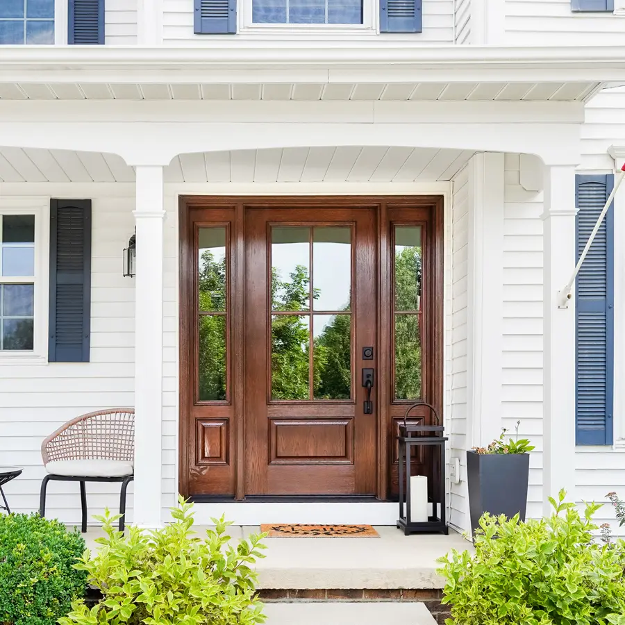 oak grain fiberglass front door on large white house