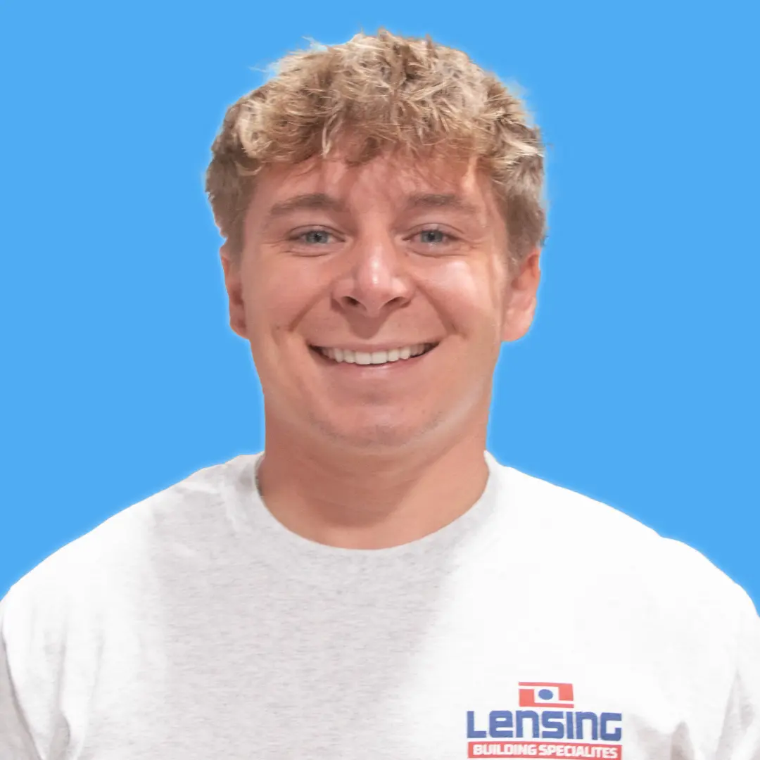 young adult male with light brown hair and gray t-shirt